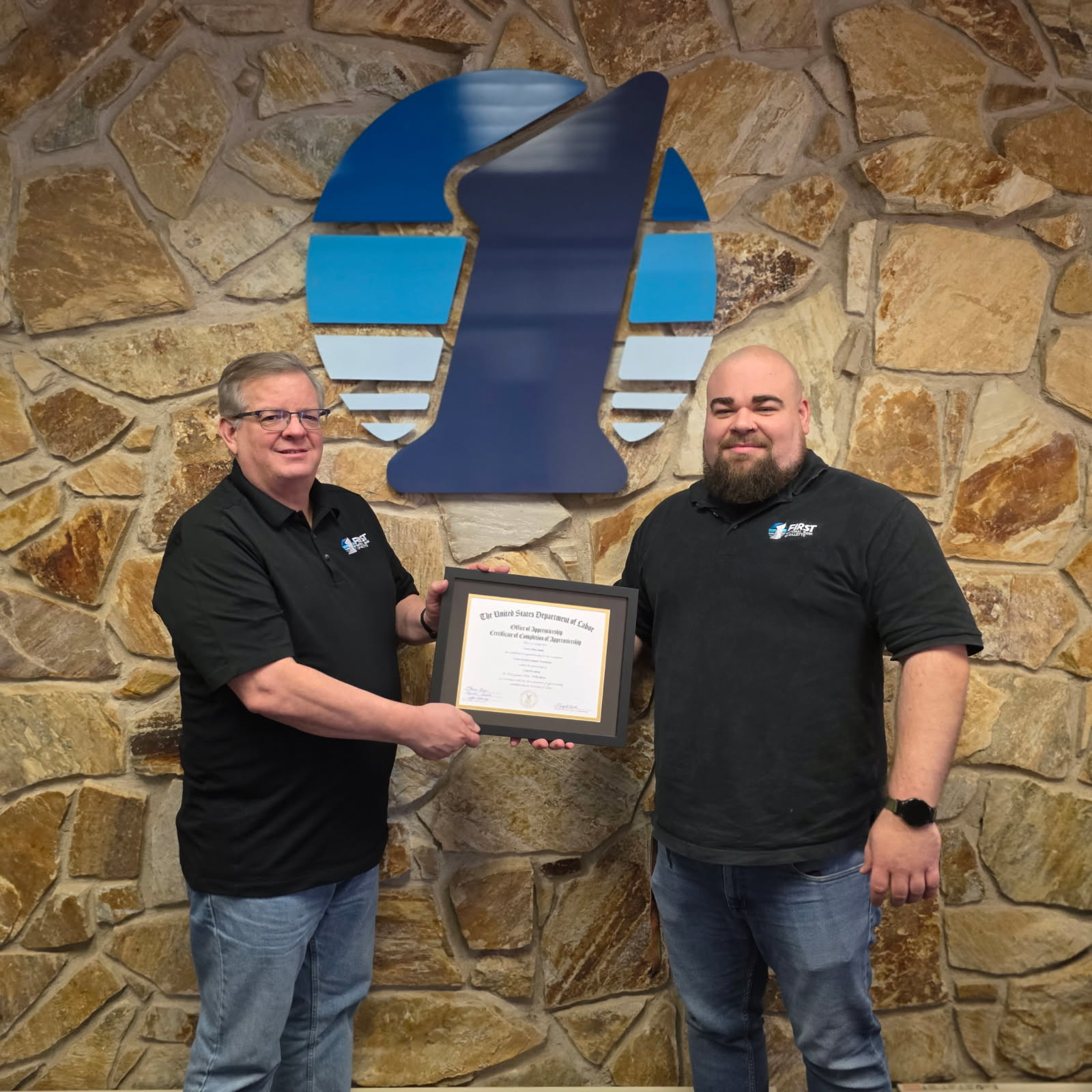 Jeff Grimes presenting Corey Smith of FNB Gillette the Department of Labor’s Registered Apprenticeship certificate.